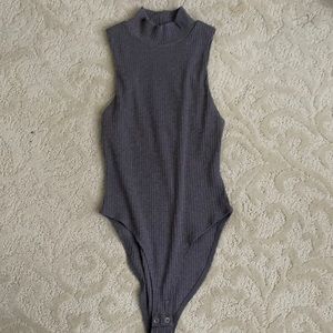 Grey bodysuit.